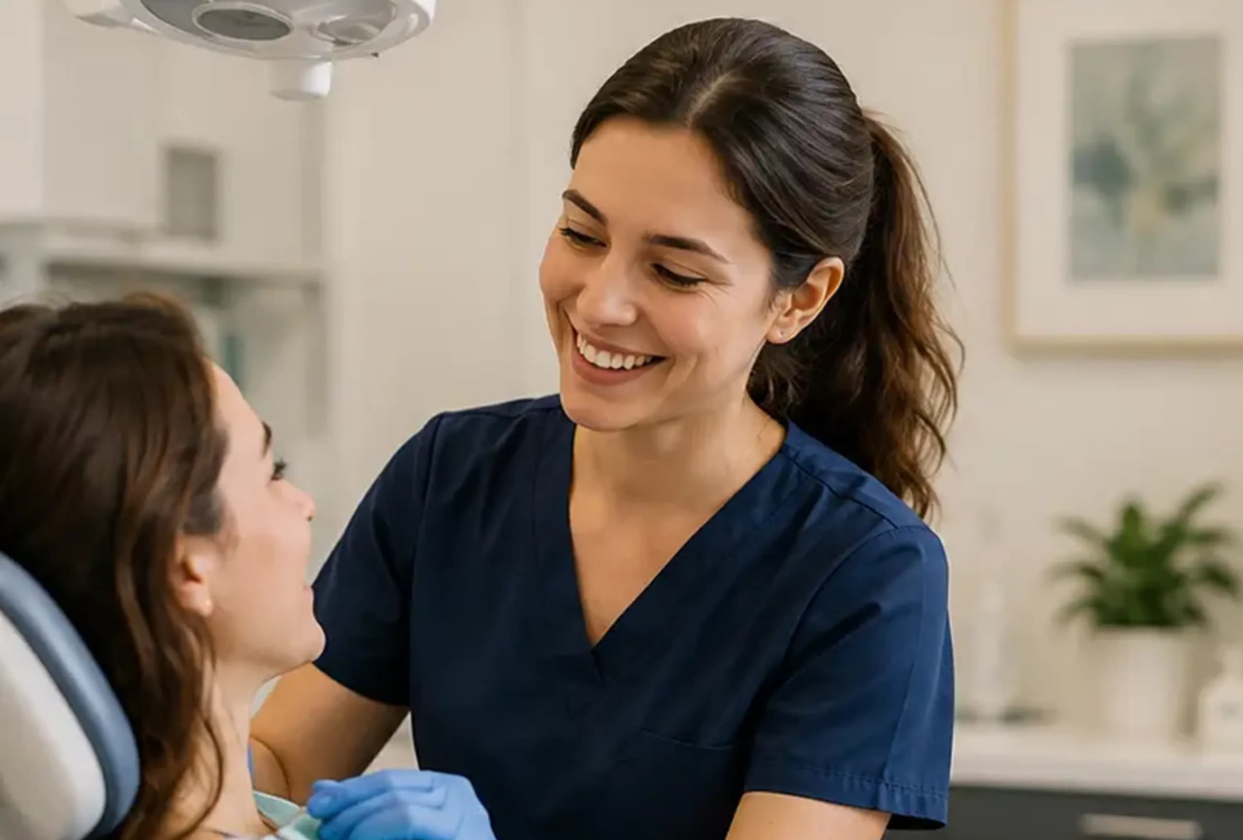 A dental hygienist with a patient